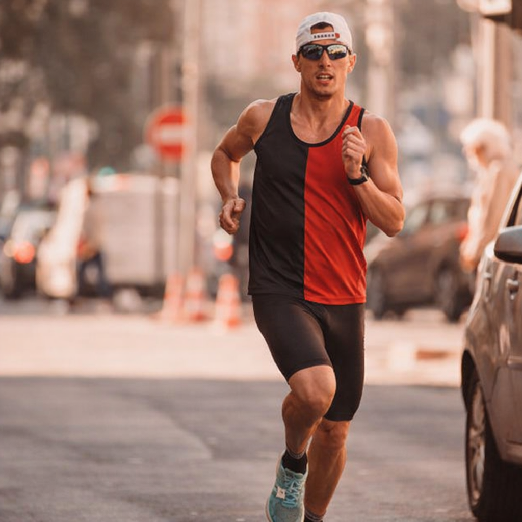 A focused male runner, wearing